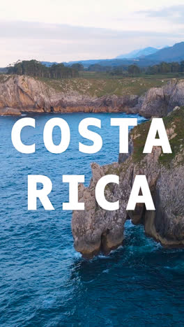 Vertical-Video-Drone-Shot-Of-Island-Coastline-With-Ocean-Overlaid-With-Animated-Graphic-Spelling-Out-Costa-Rica